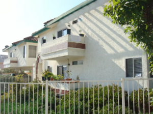 A photograph of two apartment buildings